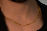 gold link chain around mans neck