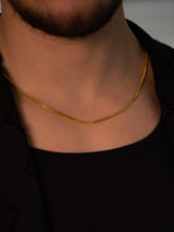 gold link chain for men over black shirt