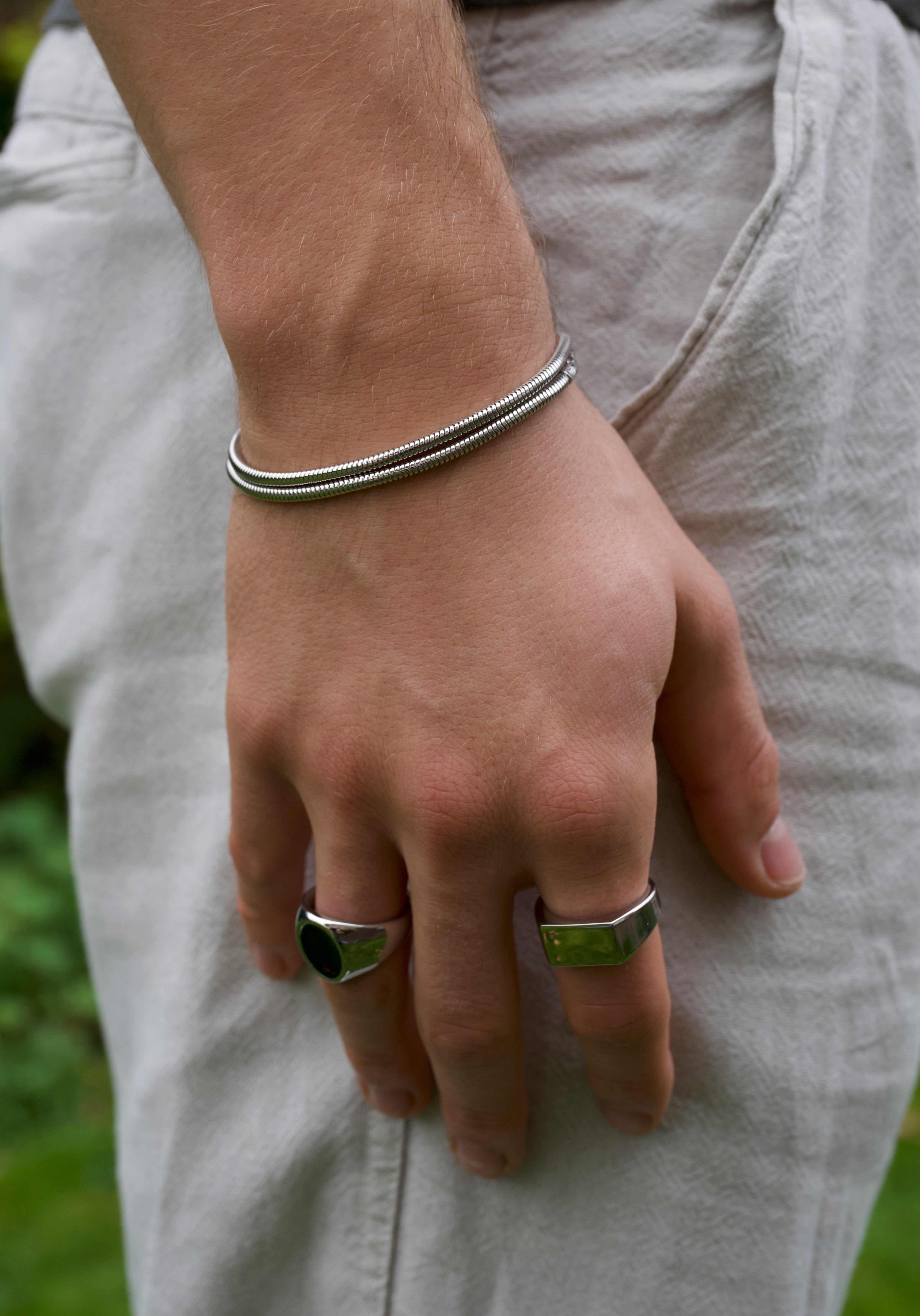 man wearing silver double band bracelet