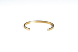 gold bracelet with logo detail